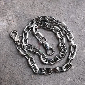 Close-up detail of silver metal hip hop chain, punk style pants chain for fashion accessory.
