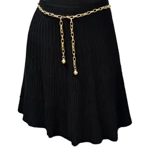 Gold chain belt detail shot, retro metal waist accessory for women, stylish spicy girl look.
