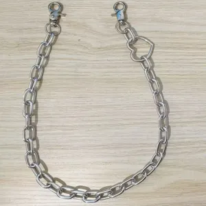 Detail shot of punk style metal waist chain with heart link and dual lobster clasps.
