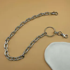 Silver metal chain detail, punk style waist chain and pants chain fashion accessory.