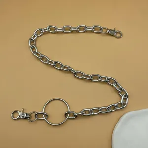 Metal pants chain detail showing punk style chunky links and ring for edgy streetwear outfits.