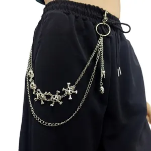 Punk style multi-layer metal skull pants chain detail, hip-hop gothic waist chain accessory.