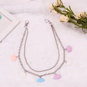 Close-up detail shot of the stylish multi-layer metal chain with cute colorful pendants.