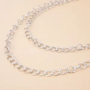Detailed view of a multi-layer silver metal chain, featuring polished links for stylish wear.