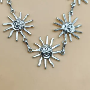 Vintage silver sun face metal waist chain body jewelry for women bohemian festival party.