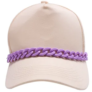 Close-up detail of stylish beige baseball cap featuring chunky purple chain accessory.