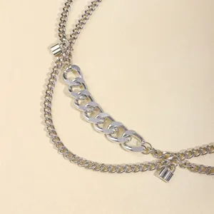 Detailed view of multi-layer metal chain waist accessory with punk style and lock charms.