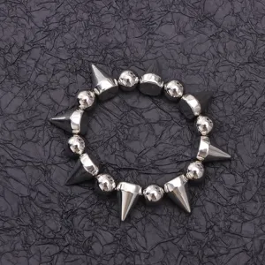 Punk style silver spike and bead choker necklace detail view, edgy metallic fashion accessory.