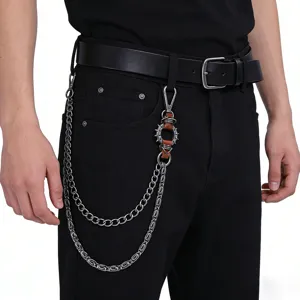 Punk metal pants chain detail, spiked ring waist accessory, silver chain and brown leather.