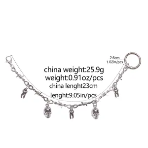 Punk style silver metal boot chain with skull and tooth charms for trendy footwear.