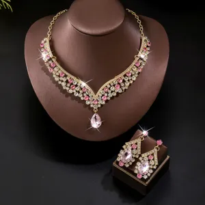 Elegant bridal rhinestone necklace and earrings set featuring stunning pink crystals.