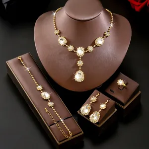 Set di gioielli da sposa dorati con strass scintillanti a goccia, collana, bracciale e orecchini.