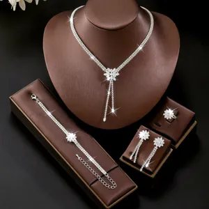 Elegant cubic zirconia jewelry set including necklace, bracelet, earrings and ring.