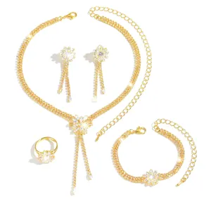 Gorgeous cubic zirconia jewelry set including sparkling necklace, earrings, ring, and bracelet.