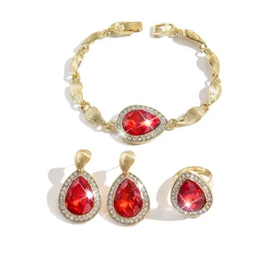 Set di gioielli in cristallo goccia rosso oro con bracciale, orecchini delicati e anello.