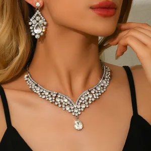 Crystal rhinestone statement necklace and earrings set detailed close up view for evening party.