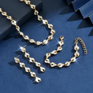 Elegante set di gioielli con collana bracciale e orecchini in cristallo dorato da sposa.