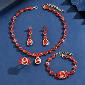 Luxurious red rhinestone teardrop jewelry set detail showing necklace earrings bracelet.