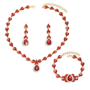 Detailed shot of luxury red crystal bridal jewelry set including necklace, earrings and bracelet.