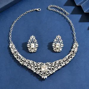 Detailed view of the luxurious vintage crystal rhinestone necklace and matching earrings set.