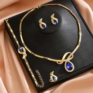 Completo di gioielli elegante in lega dorata con collana orecchini e pietra preziosa blu.