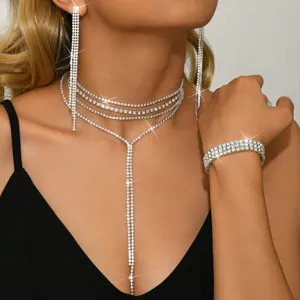 Rhinestone tassel choker necklace and earrings jewelry set detail, sparkling party wear.