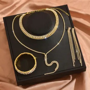 Gold rhinestone jewelry set featuring multi-layer choker, Y-necklace, bracelet and earrings.