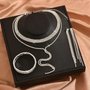 Sparkling rhinestone jewelry set including multi-layer necklace, earrings, and bracelet.