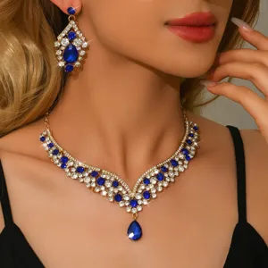 Detailed view of luxury blue crystal rhinestone necklace and earrings jewelry set for women.