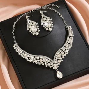 Exquisite crystal rhinestone necklace and earrings set, sparkling bridal party accessory.