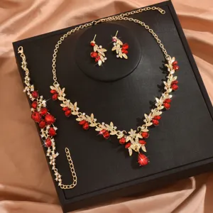 Set collana orecchini bracciale con foglia strass rosso colore oro per sposa.