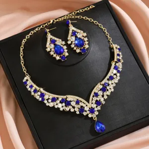 Detail shot of luxury blue crystal necklace and earrings jewelry set for banquet wear.