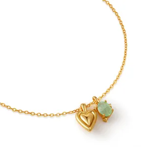 Detailed view of gold plated O-chain necklace with heart and green gem pendants for daily.