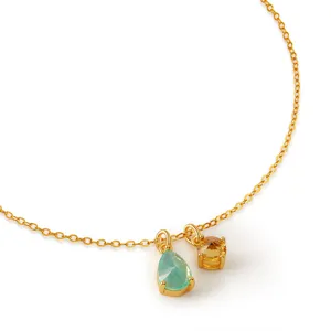 Detailed close-up of gold plated O chain necklace featuring dual colorful crystal pendants.