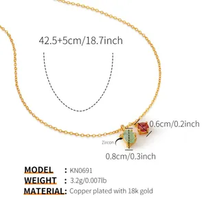 Detail view of the gold plated necklace pendant with exquisite zircon stones and fine chain links.