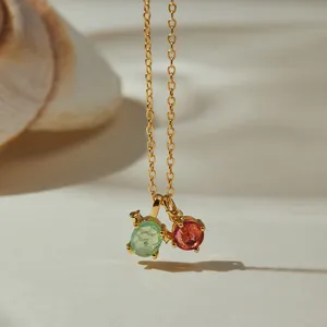 Delicate 18K gold plated O-chain necklace with dual colorful gemstone pendants close up.