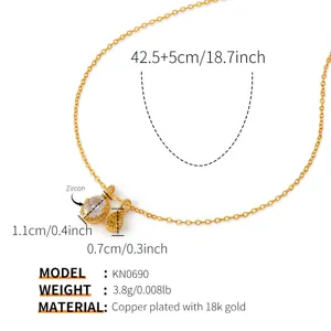 Detailed view of the 18k gold plated copper necklace featuring sparkling zircon pendants and specs.
