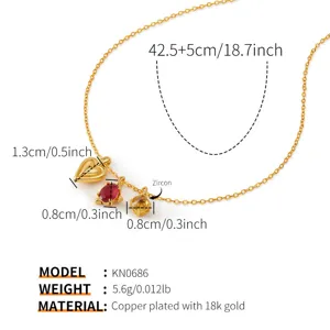 Elegantes 18k gold plated multi charm necklace with colorful zirconia for everyday fashion wear.