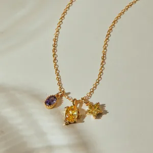 Gold-plated necklace featuring three vibrant purple and yellow zircon charms for daily wear.