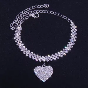 Detailed view of sparkling rhinestone anklet featuring hollow heart pendant and delicate chain.