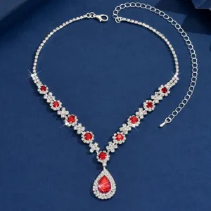 Exquisite silver teardrop necklace featuring dazzling red crystals and sparkling rhinestones.