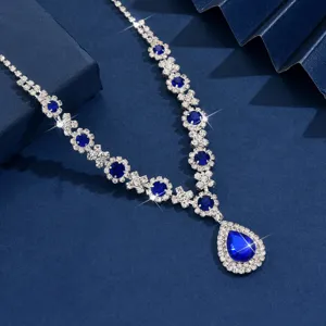 Stunning silver-tone blue teardrop crystal necklace detail view, elegant women jewelry accessory.