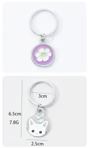 Cute metal keychain with enamel flower and cat charms, perfect accessory for keys or bags.