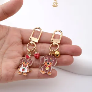 Cute dachshund keychain with strawberry and bell, metal oil-dripping bag charm gift.