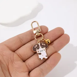 Mignon porte-clés chiot de dessin animé avec fermoir doré et clochette, super pendentif.