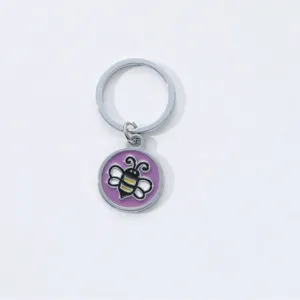 Cute cartoon bee metal keychain with purple enamel round pendant for keys and bag decoration.