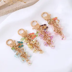 Mignon papillon fleur porte-clés sac charme, pendentif en métal élégant pour cadeau femme.