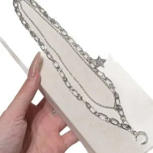 Layered silver necklace with star and moon pendant, stylish chic clavicle chain for women daily wear.