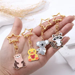 Cute cartoon animal metal keychains with star clasps including otter duck koala and raccoon.