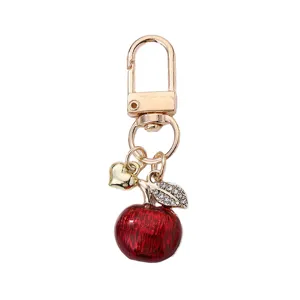 Cute apple shape metal keyring and bag charm with sparkling rhinestones and red enamel finish.